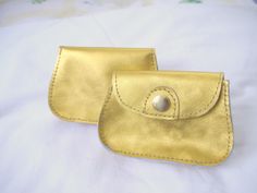 A gold purse to carry valuables!  It has enough room for cash, a few cards, and a lipstick.  There is a separate slot for the driver's license. The bright color may also be easier to find in a purse or pocket.  The gold finish on this item is vibrant and will get attention.   Dimensions are 4 ¾" X 3 ¼" and 1" deep. Thank you for viewing my items! Gold Rectangular Bag With Interior Card Slots, Rectangular Gold Bag With Interior Card Slots, Gold Wallet With Coin Pocket For Everyday Use, Compact Gold Coin Purse With Coin Pocket, Compact Gold Coin Purse, Gold Compact Wallets With Card Slots, Compact Gold Wallet With Card Slots, Compact Gold Wallet With Interior Card Slots, Gold Coin Purse With Coin Pocket As A Gift