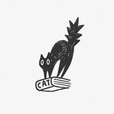 a black and white drawing of two cats on top of a piece of paper with the word cat written below it