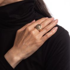 Finely detailed antique Victorian family crest signet ring (circa 1898), crafted in 10 karat yellow gold.   The oval signet mount features a family crest with the year '1898' to the base. The side shoulders feature a pretty etched foliate design. The low rise ring (3.5mm - 0.13 inches) sits comfortably on the finger.    The ring is in good condition with some wear evident. We have not cleaned it in order to preserve patina and collector value.   Particulars:  Weight: 13.5 grammes  Stones:  N/A Formal Gold Signet Ring With Coat Of Arms, Heirloom Oval Signet Ring With Coat Of Arms, Gold Oval Signet Ring With Coat Of Arms, Classic Signet Ring With Coat Of Arms For Anniversary, Classic Oval Signet Ring With Coat Of Arms, Gold Signet Ring With Coat Of Arms, Classic Yellow Gold Engraved Ring With Coat Of Arms, Heirloom Signet Ring With Coat Of Arms, Elegant Oval Signet Ring With Coat Of Arms