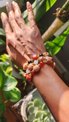 This bracelet consists of: 8mm Carnelian beads Painted wooden beads Gold plated spacer beads 📏*Length: All bracelets are measured at 7 Inches(standard women's size) they will fit 6 to 7 inch wrists. If your wrist is closer to 7 inches the fit will be comfortably snug. 📦Packaging: Every item is carefully placed in an anti oxidation zipper bag to maintain quality then put into a cute little reusable burlap bag.  *Bracelet Care* To ensure longevity of your bracelet, keep in a jewelry box or bag i Festival Wooden Beads Stretch Bracelet, Orange Bracelets With Wooden Round Beads, Unique Beaded Bracelets With Wooden Beads As Gift, Unique Wooden Beads Stretch Bracelet, Spiritual Red Beaded Bracelets With Wooden Beads, Casual Bracelets, Earthy Jewelry, Wooden Bracelet, Carnelian Beads