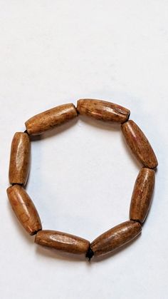 Swahi Brown African Elastic Wooden Bead Bracelet-DPJALBB61 African Dashiki Shirt, African Tops For Women, Wooden Bead Bracelet, African Pants, African Shoes, African Hats, African Tops, African Bag, Head Wraps For Women