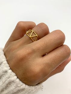 Gold Triangle Ring made of Gold Vermeil: 18k Gold over Solid 925 Sterling Silver ☞ made to last.Matching Earrings & Pendant - please ask me Details: • Minimalist Triangle Ring • Dimensions: Band width ≈ 9mm, thickness ≈ 1mm • 18k Gold Vermeil SKU R1010010335 Modern Midi Rings In Recycled Gold As Gift, Modern Recycled Gold Midi Rings As Gift, Modern Recycled Gold Midi Rings Gift, Minimalist Geometric Rings For Gifts, Minimalist Geometric Jewelry In 14k Gold, Adjustable Geometric Rings For Gifts, Unique Geometric Rings For Gifts, Adjustable Geometric Rings As Gift, Minimalist 14k Gold Geometric Jewelry