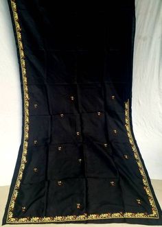 About this item Vintage Indian silk Saree 100% Pure Silk with heavy golden zari boarder What A Beautiful Masterpiece Of A Saree. Base Fabric Is 100% Pure Silk In black Color golden Amazing Tie And Dye Work. All Over Saree Adorned With Floral Design With Golden zari p Work. Work Is The Highlight Of The Saree. Kantha : Kantha Is A Hand Embroidery Style Traditionally Practiced By Rural Womenfolk In State Of West Bengal. Kantha Embroidery Is Recognized By Running Stitches. The Usual Kantha Stitch Is Done In Straight Or Horizontal Lines But Artistic Kantha Styles Emerged Over Time Where Floral Or Religious Symbols Were Also Depicted In Kantha Embroidery. Kantha Is Mostly Practiced On Pure Silk,Or Cotton Saris. A Single Kantha Sari Can Take As Many As 4-5 Days Of Work For 5-6 Women Of A House Wo Unstitched Black Art Silk Saree, Black Art Silk Saree With Zari Work, Diwali Black Tussar Silk Saree, Black Art Silk Dupatta With Pallu, Black Tussar Silk Traditional Wear For Navratri, Black Chanderi Bollywood Saree, Black Bollywood Saree With Zari Weaving, Black Chanderi Saree For Navratri, Bollywood Black Saree With Zari Weaving