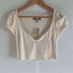 Uo Ivory Crop Top Size M 63% Polyester 33% Cotton 4% Elastane Deep V Neck Approximate Measurements Pit To Pit 15.5” Length 15” New With Tags. No Visible Holes Or Stains. See Pics For More Details. Thanks For Stopping By! 0836 Casual Cream V-neck Top, Neutral V-neck Top For Day Out, Off White V-neck Top For Day Out, Chic Off White V-neck Top, Fitted Beige Tops For Day Out, Fitted Off White Tops For Summer, Trendy Cream Tops For Summer, Fitted Cream V-neck Top, Fitted Off White Short Sleeve Tops