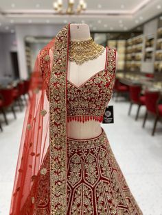 This beautiful True Red Bridal Lehenga BL-131 is the perfect choice for your special day. Made with luxurious velvet and adorned with intricate gold work, it radiates elegance and sophistication. You'll be sure to turn heads and feel confident as you walk down the aisle in this stunning piece. Fabric: Velvet! WASH CARE INSTRUCTIONS - Please Dry clean only when it is applicable! Ready to Ship! Reception Velvet Lehenga, Designer Velvet Anarkali Set With Intricate Embroidery, Fitted Lehenga With Stone Work For Festive Occasions, Elegant Lehenga With Stone Work For Designer Wear, Designer Lehenga With Stone Work For Festivals, Designer Anarkali Lehenga With Stone Work, Anarkali Lehenga With Stone Work, Elegant Fitted Lehenga With Stone Work, Traditional Designer Wear Dupatta With Stone Work