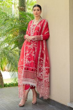 Description: The red embroidered lawn shirt comes with detailed embroidery on the front and sleeves. A matching cotton trouser and embroidered matching organza dupatta finish off the look. Materials: Shirt (Lawn) - Embroidered Front and Sleeves Dupatta (Organza) - Embroidered Organza Dupatta Trouser (Cotton) - Plain Trouser *Disclaimer: Due to the many variations in monitors and browsers, the color of products may appear different on different monitors. **Additional decorative trim has been added to the outfit in the photos. The stitched outfit will not include the additional designer trim. Red Organza Kurta For Wedding, Red Organza Sets With Dabka Work, Red Chanderi Lawn Suit For Festive Occasions, Red Unstitched Suit With Sheer Dupatta, Bollywood Red Lawn Suit For Wedding, Semi-stitched Red Unstitched Suit With Sheer Dupatta, Red Lawn Suit With Sheer Dupatta For Diwali, Semi-stitched Red Lawn Suit With Sheer Dupatta, Red Semi-stitched Lawn Suit With Sheer Dupatta