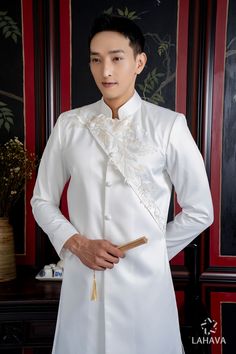 Brand new and high-quality Vietnamese traditional Ao Dai This set includes the Ao Dai and shipping with no pants for men Traditional White Ao Dai For Formal Occasions, Fitted Floral Embroidery Sets With Stand Collar, Fitted Sets With Floral Embroidery And Stand Collar, Fitted Sets With Intricate Embroidery And Stand Collar, Elegant Long Sleeve Ceremonial Ao Dai, Elegant Long Sleeve Ao Dai For Ceremonial Occasions, Elegant Long Sleeve Ao Dai For Ceremonies, Elegant Sets For Traditional Ceremonies In Spring, Elegant Long Sleeve Bandhgala For Traditional Ceremonies