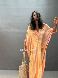 Jimbaran dress  is an oversized long sleeve soft rayon voile Long shirts  dress  .  This Oversized shirt dress is designed to flatter every body type and fit numerous occasions. 👍Included tali - f e a t u r e s - - Relaxed fit - Front pockets Fabric: 100% Soft rayon voile  Style:oversized fit Color:Bali Hand tie dyed peach & multi motif Wash :Hand cool wash  - measurement -  - One size  -  I recommend American size M to XL Chest /164cm/ 64inch(round) Length/135cm/53inch Transparent - it's  tran Oversized V-neck Maxi Dress For Day Out, Long Casual Shirt Dress For Beach, Oversized Long Sleeve Tunic For Beach Cover-up, Casual Long Shirt Dress For The Beach, Casual Long Shirt Dress For Vacation, Summer Beach Maxi Shirt Dress, Summer Long Sleeve Kaftan For Beach Cover-up, Long Shirt Dress For Beach In Fall, Flowy Long Sleeve Dresses For Beach Cover-up