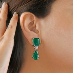 Beautifully adorned with Zambian Emerald and handmade vintage design, this Earrings will definitely grab attention. Pair it with any of your regular or special attire and let everyone appraise your sense of style. ✧✧Welcome To Our Shop Spectrum Jewels India✧✧ Zambian Emerald Earrings, Diamond Earrings, 18K Gold Wedding Earrings, May Birthstone, Gemstone Earrings, Dangle Drop Earring, Women Gift ★PRODUCT SPECIFICATION★ * ITEM CODE - CN-24578 * METAL - 18k White Gold * 18k White Gold Weight : 7.64 gm  * GROSS WEIGHT - 14.12 gm Approx. * MAKING - Handmade ★MAIN STONE DETAILS★ * STONE NAME:- Zambian Emerald, Diamond * STONE SHAPE:- Pear * DIAMOND WEIGHT:- 1 Carat * AVERAGE DIAMOND CLARITY :- SI1-SI2 * DIAMOND COLOR :- H-I * STONE WEIGHT:- 31.40 Carat * SETTING USED:- Prong * STONE COLOR:- Gree Pear-shaped Diamond Earrings With 17 Jewels, Elegant Pear-shaped Chandelier Earrings For Formal Occasions, Elegant Pear-shaped Emerald Jewelry, Formal Clip-on Diamond Drop Earrings, Elegant Pear-shaped Chandelier Earrings, Formal Teardrop Pierced Bridal Earrings, Formal Teardrop Bridal Earrings Pierced, Formal Teardrop Bridal Earrings, Fine Jewelry Emerald Pear-shaped Earrings