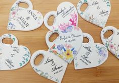 six personalized heart shaped tags with flowers on them