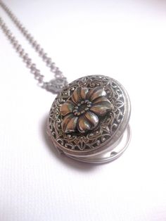 Silver Flower Locket The Locket: - Centered with a real flower in resin dome - Measures 32mm round (1.25 inches round) The connector and locket together hangs down approximately 2 inches from necklace chain. Chain: - Silver Plated - YOU CHOOSE YOUR CHAIN LENGTH FROM DROP DOWN MENU TOOL ☻☻ TO see MORE of our LOCKET NECKLACEs (while supplies last): https://www.etsy.com/shop/FashionCrashJewelry/search?search_query=locket&order=date_desc&view_type=gallery&ref=shop_search ☻ Link To My Ent Resin Flower Jewelry, Dragons Breath Fire Opal, Flower Necklace Silver, Jewelry Locket, Custom Chain, Silver Flower Necklace, Sparkle Earrings, Modern Necklaces, 판타지 아트