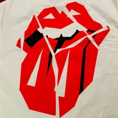 a white shirt with red and black graphics on it