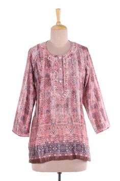 In hues of petal pink and linen intricate vines and floral motifs are printed onto this tunic from India. Shalabh designs this lovely tunic which features floral motifs around the button-up neckline that are hand-embroidered from cotton. Ear Cuff Jewelry, Cotton Handbag, Pink Tunic, Embroidered Tunic, Cotton Voile, Dress Pant, Sweater Blouse, Works Of Art, Leggings Fashion