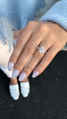 a woman's hand with a ring on it