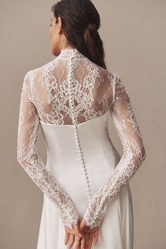 The Watters Long-Sleeve Lace Bodysuit, crafted with intricate lace and flattering details, serves as an elegant layering piece beneath a dress, adding versatility to your ensemble. | Long-Sleeve Lace Bodysuit by Watters in White, Women's, Size: 2, Polyester/Nylon/Elastane at Anthropologie Long Sleeve Lace Dress With Fitted Bodice, Lace Dress With Long Sleeves And Fitted Bodice, Long Sleeve Dress With Scalloped Lace And Fitted Bodice, Elegant Lace Dresses With Lace Cuffs, Fitted Long Sleeve Dresses With Scalloped Lace, Feminine Long Sleeve Dress With Lace Bodice, Long Sleeve Delicate Lace Dress For Formal Occasions, Long Sleeve Dresses With Lace And Fitted Bodice, Long Sleeve Lace Dress With Fitted Bodice For Wedding