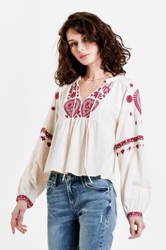 image of a female model wearing a NATALIA EMBROIDERY DETAIL TOP CREAM DEAR JOHN DENIM Cotton Blouse With Embroidered Bishop Sleeves, Embroidered Bishop Sleeve Cotton Top, Embroidered Cotton Bishop Sleeve Top, Bohemian Embroidered Top With Long Sleeves, Bohemian Embroidered Long Sleeve Top In Relaxed Fit, Long Sleeve Cotton Tops With Embroidered Hem, Long-sleeved Cotton Blouse With Embroidered Hem, Long Sleeve Cotton Blouse With Embroidered Hem, Long Sleeve Cotton Top With Embroidered Hem