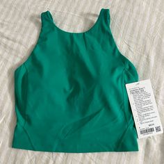 Color Kelly Green Size- 4 Brand New With Tags, Firm On Price! Sporty Green Tops For Pilates, Green Functional Tops For Light Exercise, Fitted Green Top With Go-dry, Fitted Green Tops With Go-dry Technology, Fitted Green Tops With Go-dry Feature, Green Go-dry Tops For Light Exercise, Green Racerback Top For Light Exercise, Green Sleeveless Tops For Light Exercise, High Neck Tank