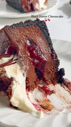 a piece of chocolate cake on a plate with ice cream and cherries in it