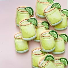 decorated cookies in the shape of glasses and limes