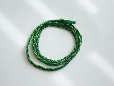 Shades of green combine in this friendship bracelet perfect for spring or summer!  The soft, high-quality cotton used is lightweight and colorfast so you can wear it non-stop, even to the shower or pool, and its a perfect choice for people with metal allergies. Green Braided Bracelet With Adjustable Cord, Green Braided Bracelets With Adjustable Cord, Green Braided Friendship Bracelet With Sliding Knot, Green Adjustable Cord Friendship Bracelets For Beach, Adjustable Green Friendship Bracelets For Summer, Green Braided Bracelets As Summer Gifts, Handmade Green Braided Bracelets For Beach, Green Adjustable Cord Bracelets For Beach, Handmade Green Braided Bracelet For Beach