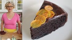 a woman standing in front of a chocolate cake with coins on it and a plate