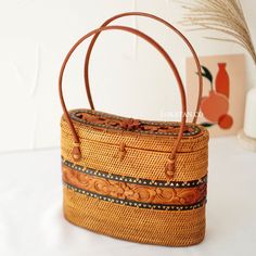 Traditional Brown Rectangular Shoulder Bag, Rectangular Handwoven Satchel For Daily Use, Handwoven Rectangular Satchel For Daily Use, Rectangular Bag With Bamboo Handle As Gift, Brown Basket Bag With Top Carry Handle, Brown Basket Straw Bag With Detachable Handle, Rectangular Bag With Bamboo Handle For Gift, Rectangular Bags With Bamboo Handle For Gift, Traditional Rectangular Straw Bag As Gift