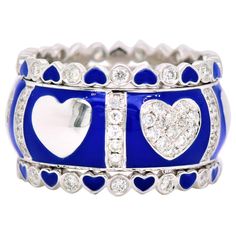 Gorgeous and Trendy 18k White Gold with Blue Enamel and Diamond Inlay "Hearts & Diamonds" Band with Two Parallel Thin Bands Bordering. (one piece) Total Carat Weight: 1.03 Carats (total 95 stones) Metal: 9.32 grams, 18k White Gold Enamel Ring, American Diamond, Gold Enamel, Diamond Heart, Diamond Bands, White Gold Rings, Heart Design, Fashion Rings, Metallica