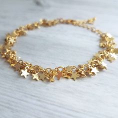 Tiny clusters of gold miniature star fringe, finished with an adjustable chain and lobster claw clasp. 14k gold plated brass. Now available in a soft matte silver rhodium finish {not shown}. { M e a s u r e m e n t s } Bracelet shown adjusts to fit approx 6.25 - 8 in (15 - 19.5cm). Each little star is approx 1/4 inch {approx 5mm} tall. Please double check measurements on your own wrist prior to any purchase, if you have any doubt or concern about the fit. I'm happy to shorten the length free of Lucky Charm Bracelet, S Bracelet, Good Luck Bracelet, Star Cluster, Good Luck Gifts, Star Chain, Star Bracelet, Bar Earrings, Gold Star