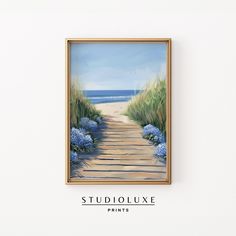 a painting hanging on the wall next to a white wall with blue flowers and grass