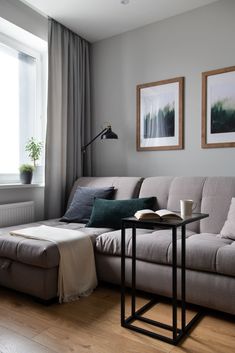 a living room scene with focus on the couch and coffee table in the foreground