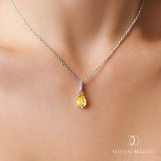 About This Necklace
The signature essence of the November birthstone will leave you in autumn's nostalgia. Our authentic Moon Magic Citrine Necklace - Birthstone Necklace Sway's dainty yet captivating pear shape takes center and reminds you to keep smiling and hold your head high amidst the chaos of life.    Details
- Authentic Moon Magic Citrine - - Stone Size: 0.35" x 0.24" (9mm x 6mm)- Cut: Pear-shaped brilliant cut- Chain Length: 16.5" (42cm), 1st ext. Silver Citrine Necklaces With Birthstone, Citrine Birthstone Pendant Necklaces, Unique Silver Citrine Necklace, Luxury Citrine Pendant Necklace, Yellow Citrine Pendant Necklace, Citrine Jewelry, Citrine Pendant, Citrine Necklace, Moon Magic