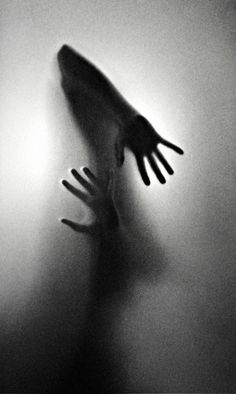 the breaking point is shown in this black and white photo with hands coming out from behind