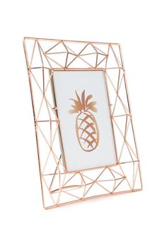 a metal frame with a gold pineapple on the front and bottom, in white background