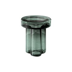 an empty glass vase sitting on top of a table