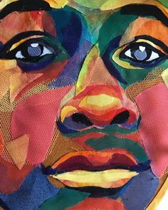 a painting of a woman's face with many different colors