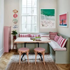 a table with two stools in front of it and a bench on the other side