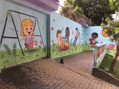 children's murals painted on the side of a building