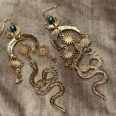 Sun & Moon Stars Dangling Snake Earrings Brand New Goldtone With Fax Pearl 4 “ Long Sun Moon Stars, Snake Earrings, Skull Earrings, Moon Stars, Cat Earrings, Wire Earrings, Gold Earrings Dangle, Gold Texture, Earrings Color