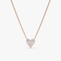 Riley Cherish a symbol of love and enduring affection with this delicate Diamond Inlay Heart Necklace. This exquisite piece features a classic heart-shaped pendant, meticulously crafted from solid 14k gold (available in yellow, white, or rose gold). The highlight of the pendant are the sparkling diamonds inlay, adding a touch of brilliance and timeless elegance. - Handmade- Solid Gold- Natural Diamonds - G Color, SI Quality Diamonds- Pendant Size: 6.5 mm- Total Diamond Carat Weight: 0.25 ctw All Dainty Heart Necklace, Diamond Carat, Sparkle Diamonds, Moissanite Diamonds, Quality Diamonds, Silver Diamonds, 18k Rose Gold, Diamond Pendant, Heart Necklace