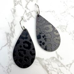 Laser cut black in black leopard acrylic earrings surgical steel, hypoallergenic nickel and lead free approximaty 2.5” handmade by me Trendy Black Nickel-free Earrings, Black Edgy Dangle Earrings, Edgy Black Dangle Earrings, Black Laser Cut Jewelry As Gift, Black Laser Cut Jewelry, Black Laser Cut Jewelry Gift, Edgy Black Adjustable Earrings, Black Enamel Metal Earrings, Edgy Black Earrings For Gift