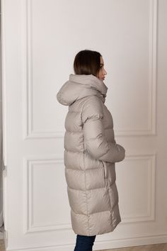 Description: Luxurious midi down jacket delivers a sophisticated winter look with a feminine silhouette and luxury details. Soft satin finish is crafted from ultra sleek, water-repellent Italian fabric. With its modern look down-and-feather insulated channels, the Alaska® 2023-2024 coat is as functional as it is stylish. Product Details: Temperature range: up to -20°C (-4°F) Insulation: 90% white goose down, 10% white feather Shell: water-resistant polyamide/neylon blend fabric Please note: prod Puffy Clothes, Luxury Details, Winter Puffer Coat, Winter Puffer, Winter Model, White Goose, White Feather, Feminine Silhouette, Padded Coat