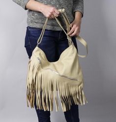 LEATHER BOHO BAG FRINGE LEATHER BAGSoft zippered leather bag.This Handbag is the perfect size to carry your daily essentials in style! It is made from high quality leather.This leather bag is a perfect everyday bag! There is a lot of space and you can put there everything in your everyday life.* Different colors* Lining* An external pocket on the back* Includes internal pockets for mobile phone and other small items.Dimensions:height: 31 cm (12.2 in)width: 39 cm (15.3 in)strap: max 130 cm (51.2 Beige Fringe Shoulder Bag For Travel, Beige Fringe Shoulder Bag For Daily Use, Chic Beige Fringe Shoulder Bag, Beige Tassel Tote Shoulder Bag, Tasseled Shoulder Bag For Daily Use, Beige Fringe Tote Shoulder Bag, Beige Fringe Shoulder Bag For Shopping, Chic Beige Fringe Bag, Beige Fringed Hobo Tote Bag