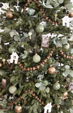 a christmas tree with ornaments and pictures on it