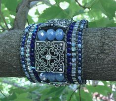 "ICE PRINCESS, Blue Bracelet, Blue beaded cuff, beaded cuff, wide bracelet, beaded leather cuff, Twinkling Of An Eye, beaded cuff, Statement Please NOTE: I made these beaded cuffs a few years ago when they were all the rage. While rebranding my shop and creating my new work area, I carefully stored them away where they would be safe. Because of a series of life events, I put my shop \"on hold,\" and completely forgot about this treasure trove of beaded cuffs. I was quite surprised just stumbling Leather Cuff Bracelet Diy, Cuff Bracelets Diy, Winter Earrings, Beading Cord, Ice Princess, Wide Bracelet, Bracelet Blue, Rainbow Earrings, Beaded Cuff