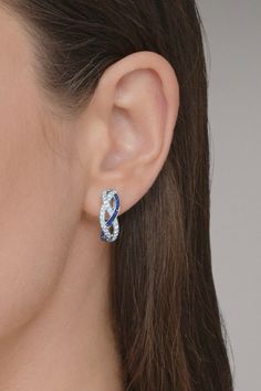 Kwiat sapphire diamond braided hoop earrings in white gold. 18K White Gold 0.50ctw Diamonds (GH, VS1-2), Blue Sapphire 0.75" L Luxury Sapphire Hoop Earrings For Anniversary, White Gold Sapphire Jewelry With Pave Setting, Elegant Sapphire Hoop Earrings With Prong Setting, Blue Diamond Round Hoop Earrings, Elegant Sapphire Hoop Earrings, Sapphire Hoop Earrings With Prong Setting, Blue Diamond Hoop Earrings, Blue Sterling Silver Earrings With Pave Setting, Blue Cubic Zirconia Hoop Earrings For Anniversary