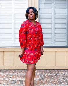 Cotton Dress with vibrant red and green geometric print. V-neck Vibrant & Bold Red & Green print Hand Embroidery Lace trim embroidery and stitching across bodice, steeves and waist Pom Pom detail at hem Tassel tie in back Loose/flowy fit Elastic on bottom of sleeves Dress is short(er) in length. Above the knee. Model is 5'3" wearing a size Medium. Red Bohemian V-neck Mini Dress, Bohemian Red V-neck Mini Dress, Red Bohemian V-neck Dress, Red V-neck Bohemian Dress, Red V-neck Cotton Mini Dress, Printed Red V-neck Dress, Red Printed Cotton Dress, Gem Dress, Trim Embroidery