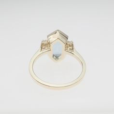 "We designed and handmade this ring in 14k yellow gold. The center natural aquamarine weight is 2.85 carats and measurements are 11 mm x 7 mm. The six side diamonds carat weight is .13 carats. We can make it any size from 5.75 to 6 and you still be able to return it within the listed time frame. Sizing outside of that range makes it a FINAL SALE. We love this ring because it represents the way jewelry should be made with craftsmanship and quality. This ring is anything but ordinary. Our pieces a Formal Octagon Sapphire Ring In 14k Gold, Formal 14k Gold Octagon Sapphire Ring, Anniversary Rings With Polished Octagon Shape, 14k Gold Octagon Rings With Polished Finish, Modern Octagon Ring With Accent Stones, Fine Jewelry Octagon Ring With Polished Finish, Modern Octagon Rings With Accent Stones, Yellow Gold Octagon Topaz Ring For Anniversary, 14k Gold Octagon Sapphire Ring For Anniversary