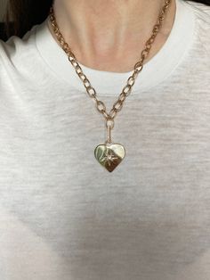 A vintage vibe emanates from this pairing of our Galaxy Heart Pendant and Oval Link Charm Chain. The pendant is hand engraved with a star and accented with your choice of a burnished set Diamond, Ruby, Pink Tourmaline, Blue Sapphire, Turquoise or Emerald. 3.5grams 14kt Gold, Polished Finish .20cts Precious or Semi-Precious Gemstone .5" Elongated Pave Diamond Enhancer (Included) 16" Chain, 1" Pendant Exquisitely Handcrafted in Los Angeles Galaxy Heart, Diamond Enhancer, Our Galaxy, Charm Chain, Vintage Vibe, Vintage Vibes, Hand Engraving, 14kt Gold, Pink Tourmaline