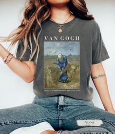 ✿ Unisex Vincent Van Gogh T-Shirt  Our shirt showcases Vincent van Gogh's enchanting masterpiece, "Peasant Woman Binding Sheaves." For the passionate art lover, this wearable artwork captures the rustic charm and timeless beauty of van Gogh's pastoral scenes, inviting you to revel in the simplicity and vitality of rural life. The shirt embodies the ethereal allure of post-impressionist art making it a perfect gift for art teachers and art lovers. T-SHIRT DETAILS We use COMFORT COLORS for our T-s Graphic Cotton T-shirt With Artwork, Artsy Short Sleeve T-shirt With Artwork, Cotton Crew Neck T-shirt With Artwork, Casual T-shirt With Letter Print For Artistic Expression, Graphic Tee With Custom Artwork And Relaxed Fit, Cotton Art With Graphic Print For Artistic Expression, Relaxed Fit Graphic Tee With Custom Artwork, Artsy Crew Neck T-shirt With Graphic Design, Artsy Summer T-shirt