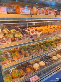 a display case filled with lots of different types of pastries